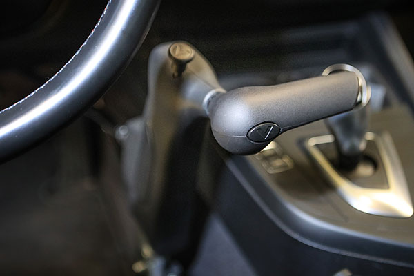 Photo of Person hand on a car gear stick